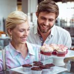 cute-couple-on-a-date-looking-at-cakes-at-the-bakery.jpg